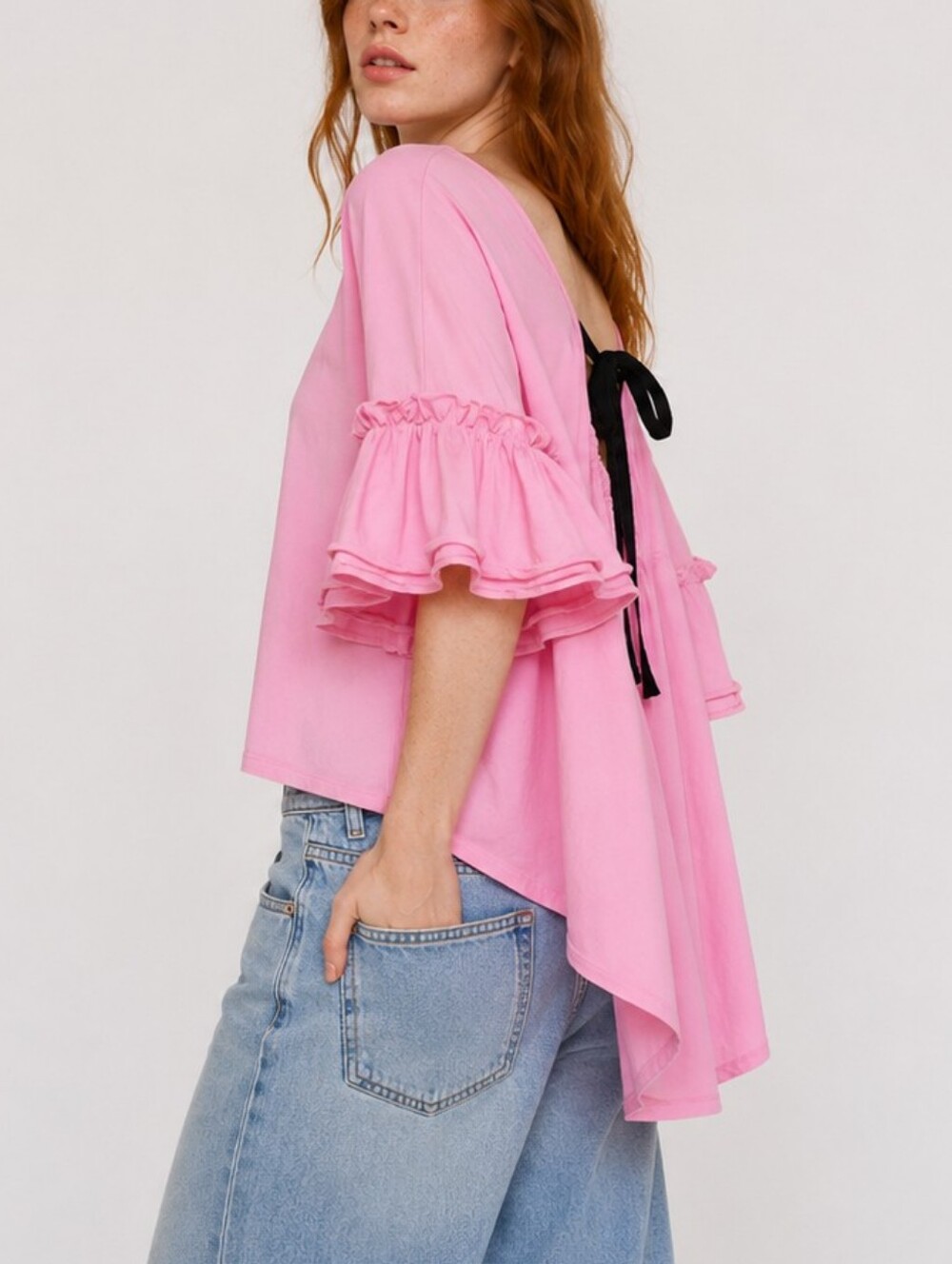 After Market Flutter Elbow Length Oversized High Low Bow Tie Top in Baby Pink